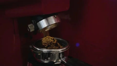 Coffee is poured into a cup from a coffee grinder Stock Footage 167889062