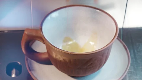 Coffee poured into a cup of coffee machine. Stock Footage 102752065