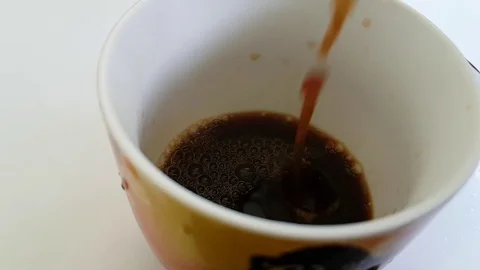 Coffee is poured into the cup Stock Footage 89257399
