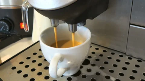 Coffee  poured into the cup Stock Footage 98493369