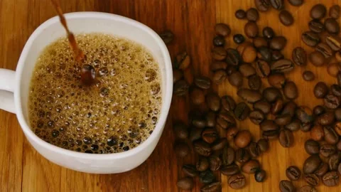 Coffee is poured into a cup Stock Footage 232327412