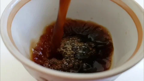 Coffee is poured into the cup slow motion Video stock 88529340