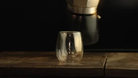 Coffee is poured into a glass Stockbeeldmateriaal 252380075
