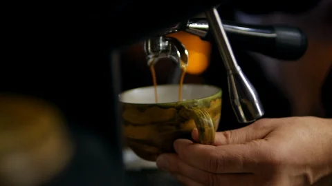 Coffee is poured into a mug. coffee machine. making coffee. side shot Stock Footage 129173093