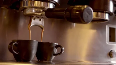 Coffee pouring in brown cups Stock Footage 218601612