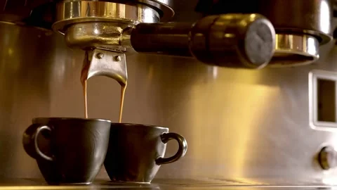 Coffee pouring in brown cups Stock Footage 218601620