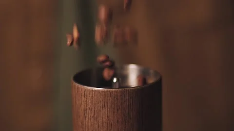Coffee is pouring into the coffee grinder. Stock Footage 138497979