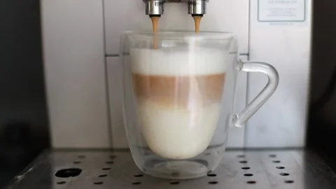 Coffee pouring into the coffee machine Stock Footage 204014917