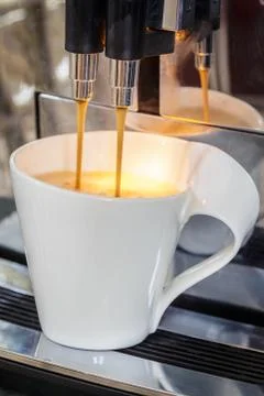 Coffee pouring into a cup Stock Photos