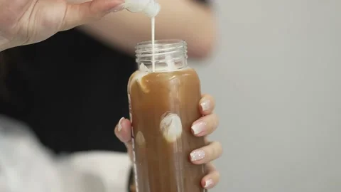 Coffee pouring into milk Stock Footage 154834770