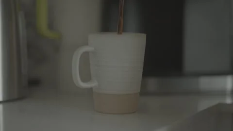 Coffee Pouring in Mug in the Morning Stock Footage 323401751