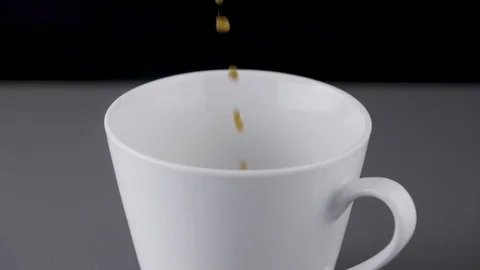 Coffee pouring into white cup Stockbeeldmateriaal 94256242
