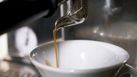 Coffee pouring in a white cup Stock Footage 96058087