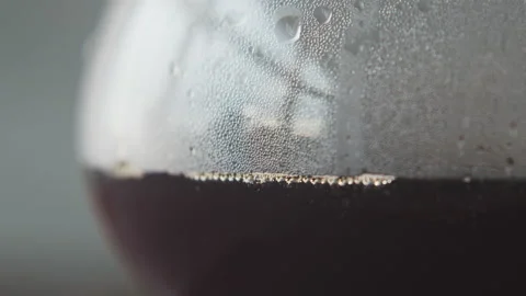 Coffee in a pourover jar with coffee inside on a wooden table on a coffee shop Stock Footage 140609394