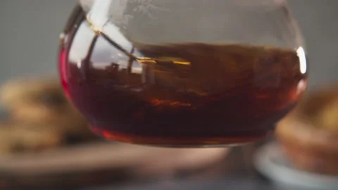 Coffee in a pourover jar with coffee inside on a wooden table on a coffee shop Stock Footage 140742612
