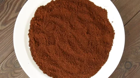 Coffee powder vibrating on a white plate. Stock Footage 324786904