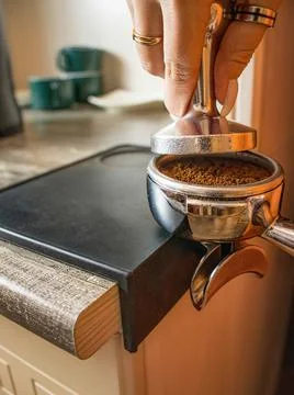 Coffee from a professional coffee machine  with a bottomless filter Foto stock