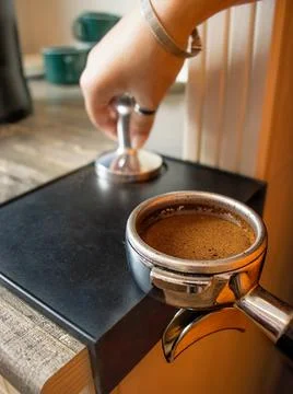 Coffee from a professional coffee machine  with a bottomless filte Stock Photos