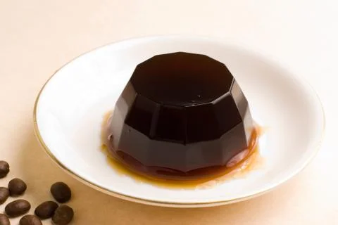 Coffee pudding on white ceramic dish Stock Photos