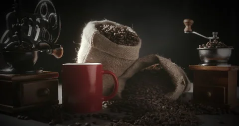 Coffee red cup and coffee beans.Hot coffee cup and handful coffee beans.Close-up Stock Footage 221265855