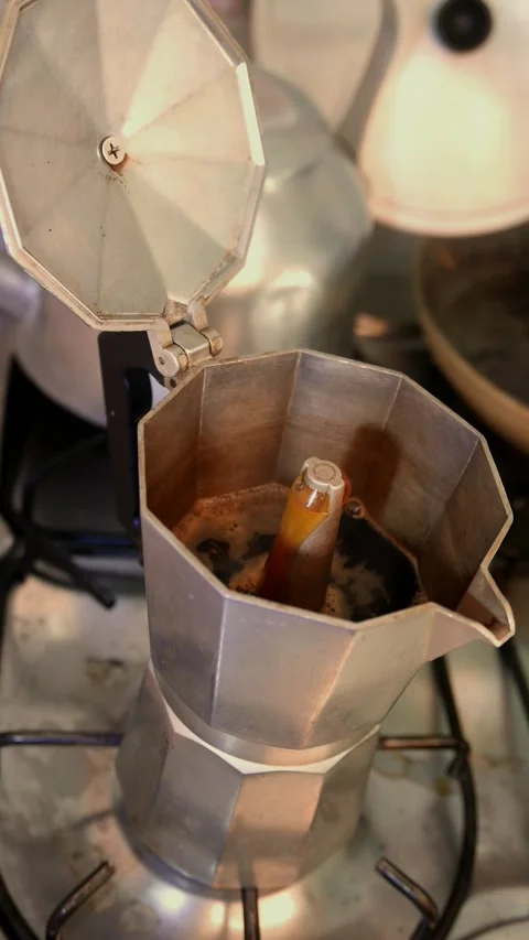 Coffee rising from the coffee maker. POV: preparing espresso. Black coffee. Stock Footage 340445454