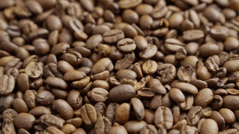 Coffee roasted beans rotating. Harvest of tasty coffee. Arabica. Heap of beans Stock Footage 304741052