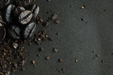 The coffee roasted on black texture close up background... Stock Photos