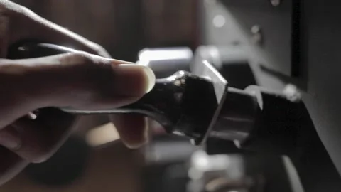 Coffee Roaster Checking out Coffee Beans to see if they properly roasted Stock Footage 143383903