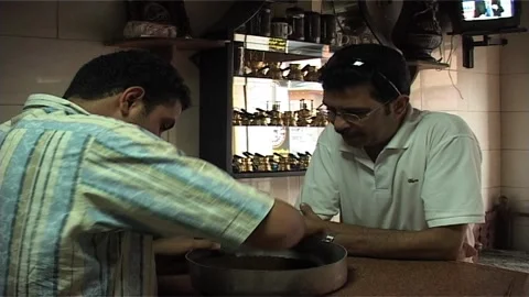 Coffee Roaster with Client At Roasted Coffee in Egypt Stock Footage 285847799