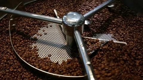 Coffee roaster cooling off fresh roasted coffee beans Batch of Beans in cylinder 스톡 동영상 334643549
