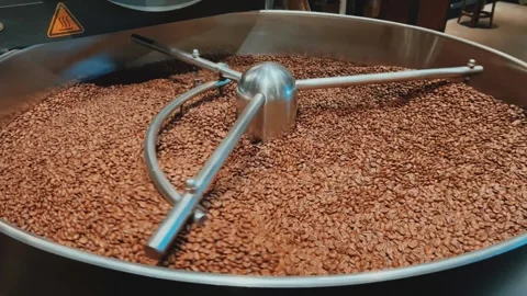 Coffee roaster machine at coffee roasting process. Mixing coffee beans.  Stock Footage 308008423