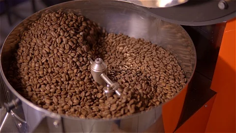 Coffee roaster .VAT for roasting coffee beans. roaster. Coffee beans in the Stock Footage 99750147