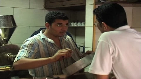 Coffee Roaster at Work With Clients in Egyptian Shop Stock Footage 285847730
