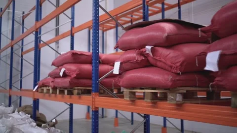 At a coffee roasting plant. The machine is in the process of roasting coffee. Video stock 220677778
