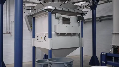 At a coffee roasting plant. The machine is in the process of roasting coffee. Video stock 220678331