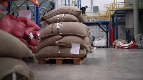 At a coffee roasting plant. The machine is in the process of roasting coffee. Video stock 220678671