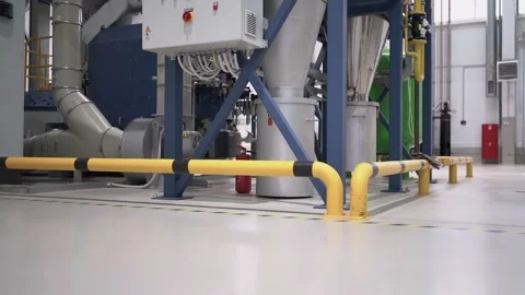 At a coffee roasting plant. The machine is in the process of roasting coffee. Video stock 220679841