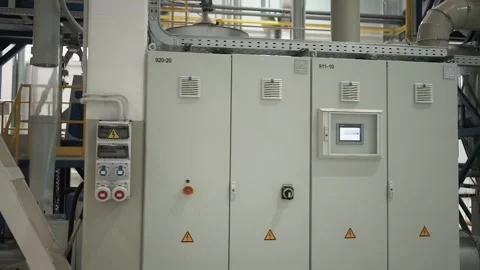 At a coffee roasting plant. The machine is in the process of roasting coffee. Video stock 220680230