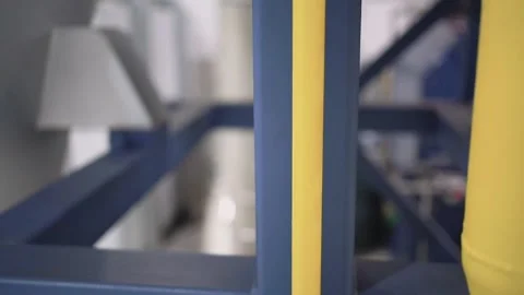 At a coffee roasting plant. The machine is in the process of roasting coffee. Video stock 220681313