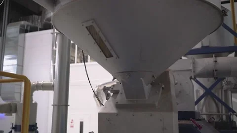 At a coffee roasting plant. The machine is in the process of roasting coffee. Video stock 220683686