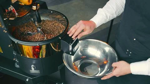 Coffee Roasting Process in Action. A close-up view of freshly roasted coffee Stock Photos