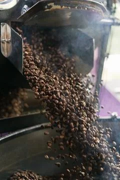 Coffee roasting process. close up Stock Photos