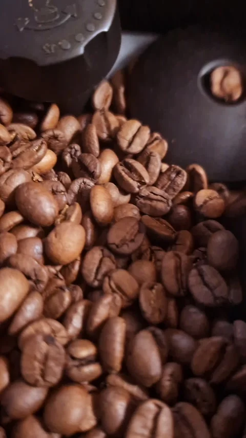 Coffee roasting process from raw beans to dark roast in a home kitchen setting Stock Footage 327611735