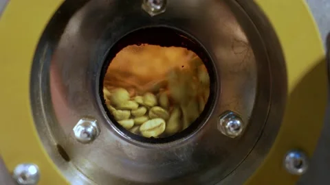 Coffee Roasting Process - raw coffee beans in roasting machine Stock Footage 143869297
