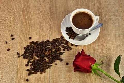 Coffee with, rose and coffee beans Stock Photos