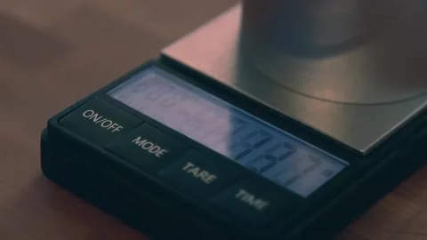 Coffee scale weighing beans in grinder Video stock 169260233