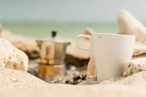 Coffee at the seaside by the campfire. Stock Photos