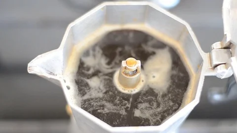 Coffee shoots from a geyser coffee maker Stock Footage 117334802
