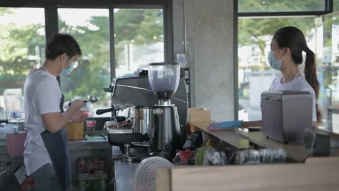 Coffee shop concept of 4k Resolution. The staff are cleaning the cafe in the  Video stock 153318839