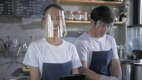 Coffee shop concept of 4k Resolution. Asian female employees are taking order Stock Footage 153319116